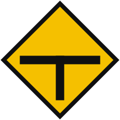 A yellow diamond showing a black T shape